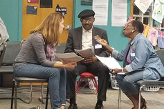 Three people in dialogue.